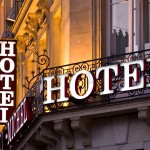 Illuminated Parisian hotel sign